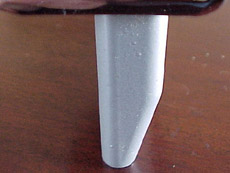 Side view of a stock Fender Block
w/ rear bevel on a Fender American Standard bridge